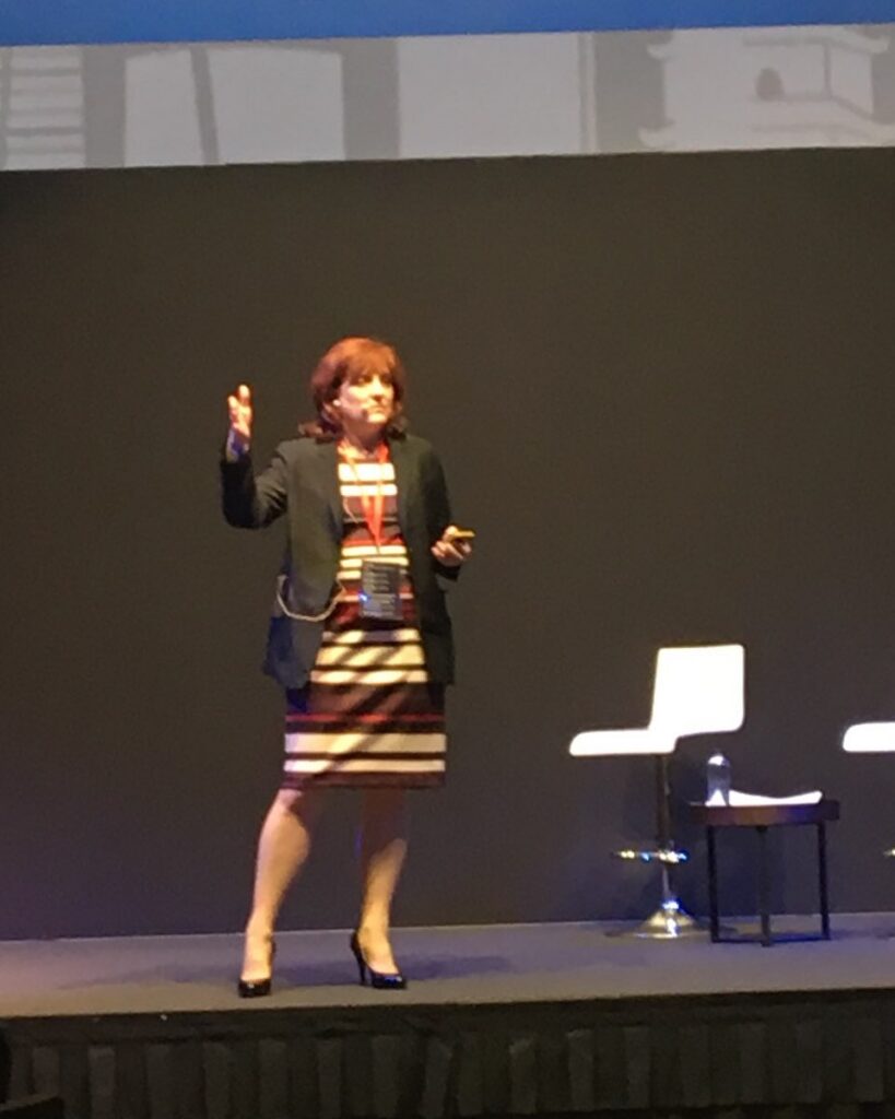 Nina Labonte - Giving a speech in Singapore during a legal conference.
